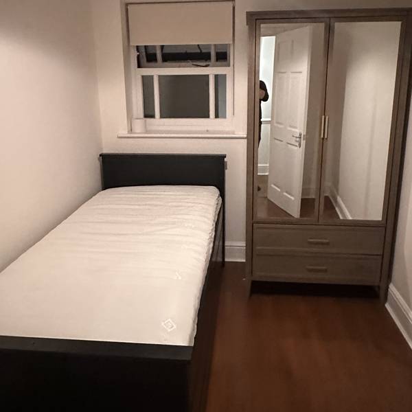 Wardrobe and bed assembled in a bedroom